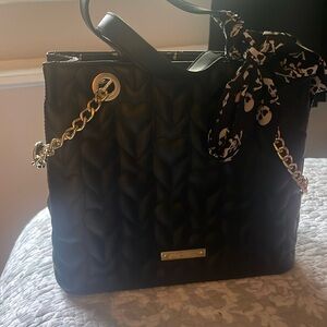 Brand New W/O Tags Betsy Johnson bag with Hearts on outside of bag.  Never used